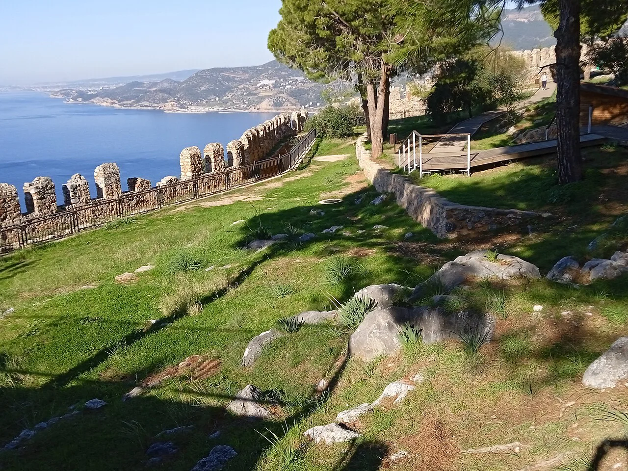 The walls of Alanya Castle above the coast.