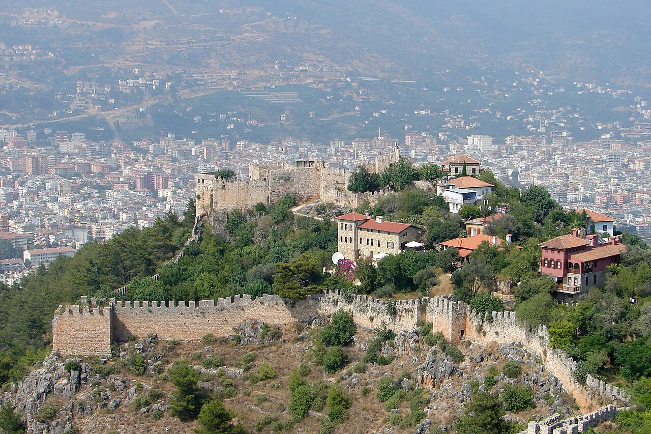 The walls of Alanya Castle above the city.