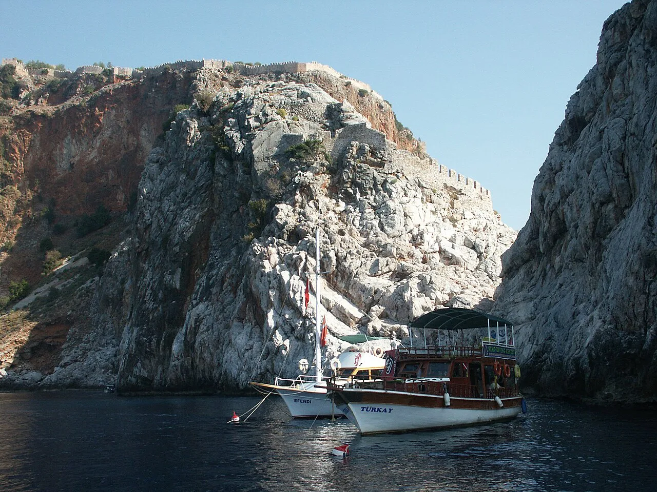 Boats beneath the cliffs of Alanya's castle hill.