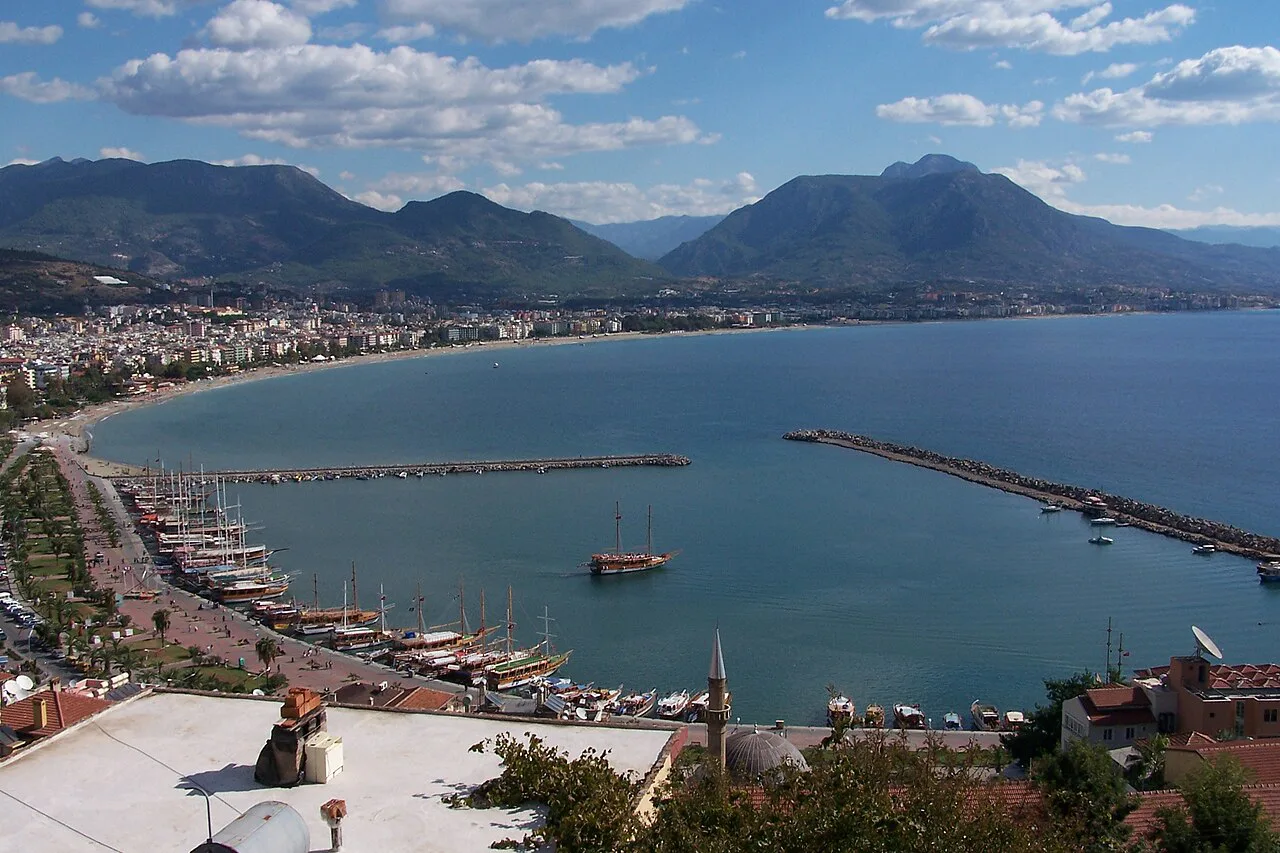 Alanya harbour and seafront with the Taurus Mountains behind.