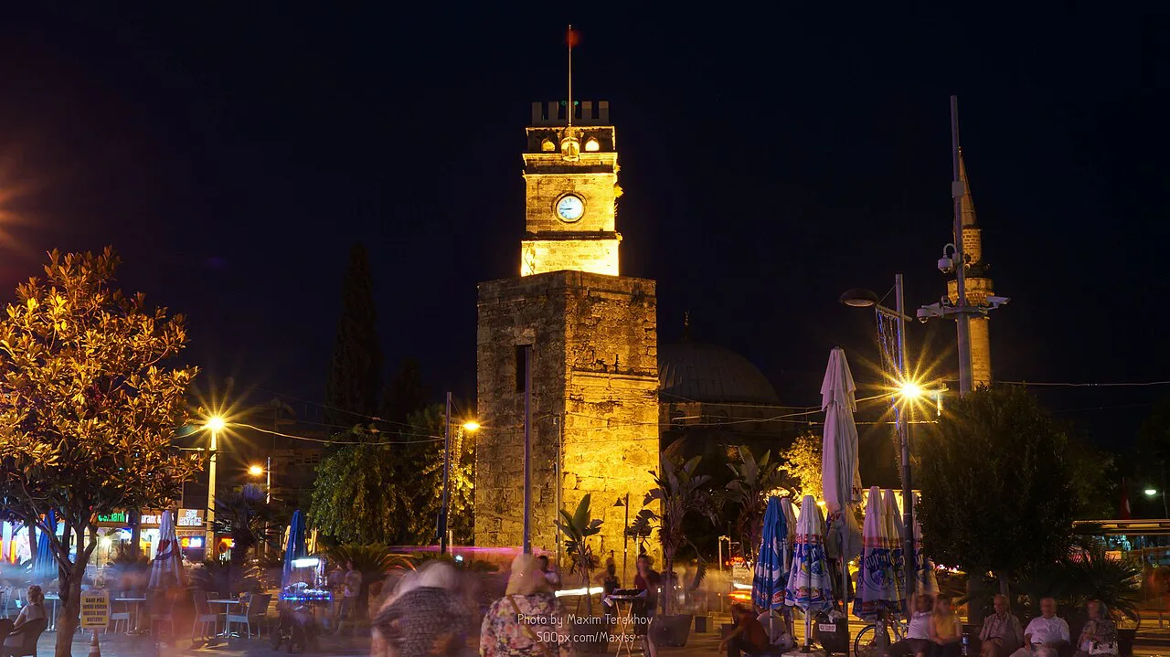 Antalya's Clock Tower lit up at night.