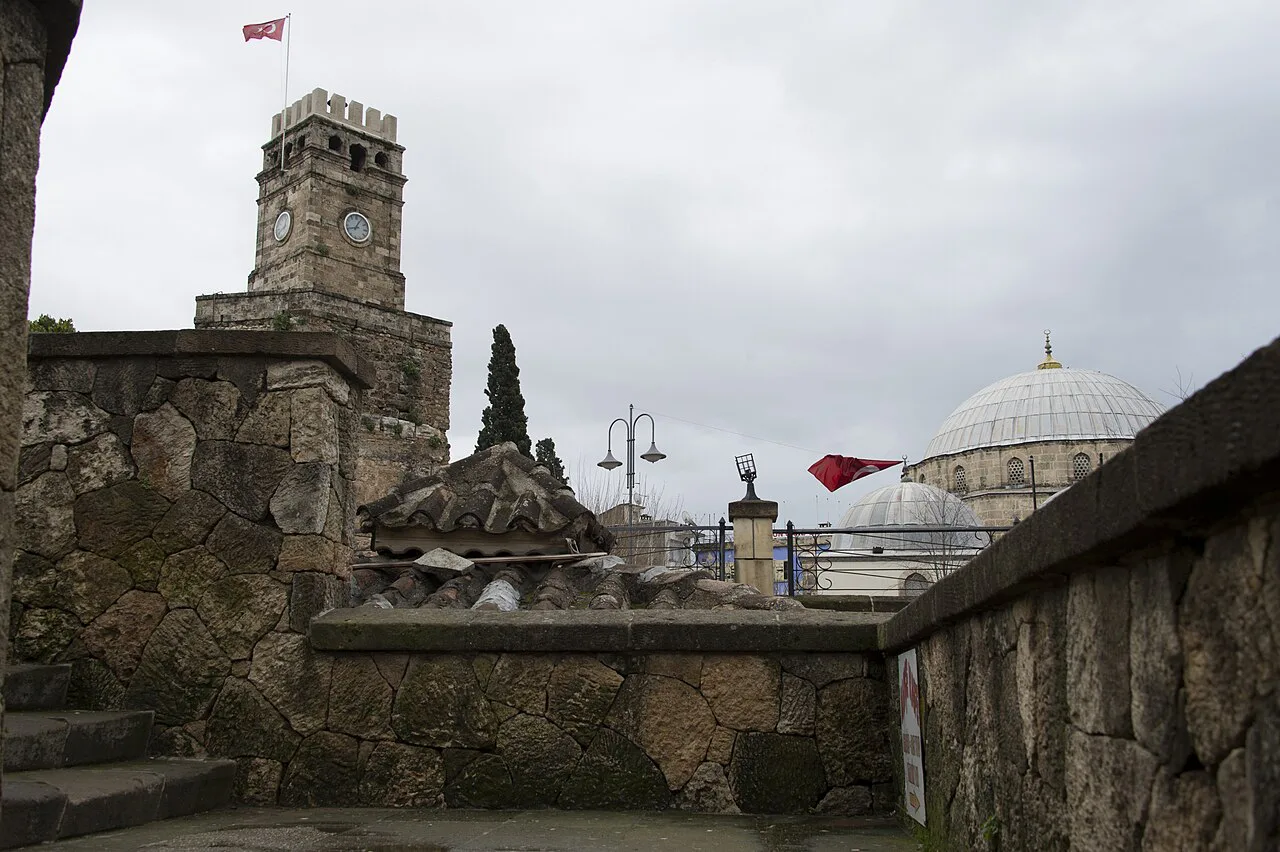 The Clock Tower and old city walls at the edge of Kaleiçi, Antalya.