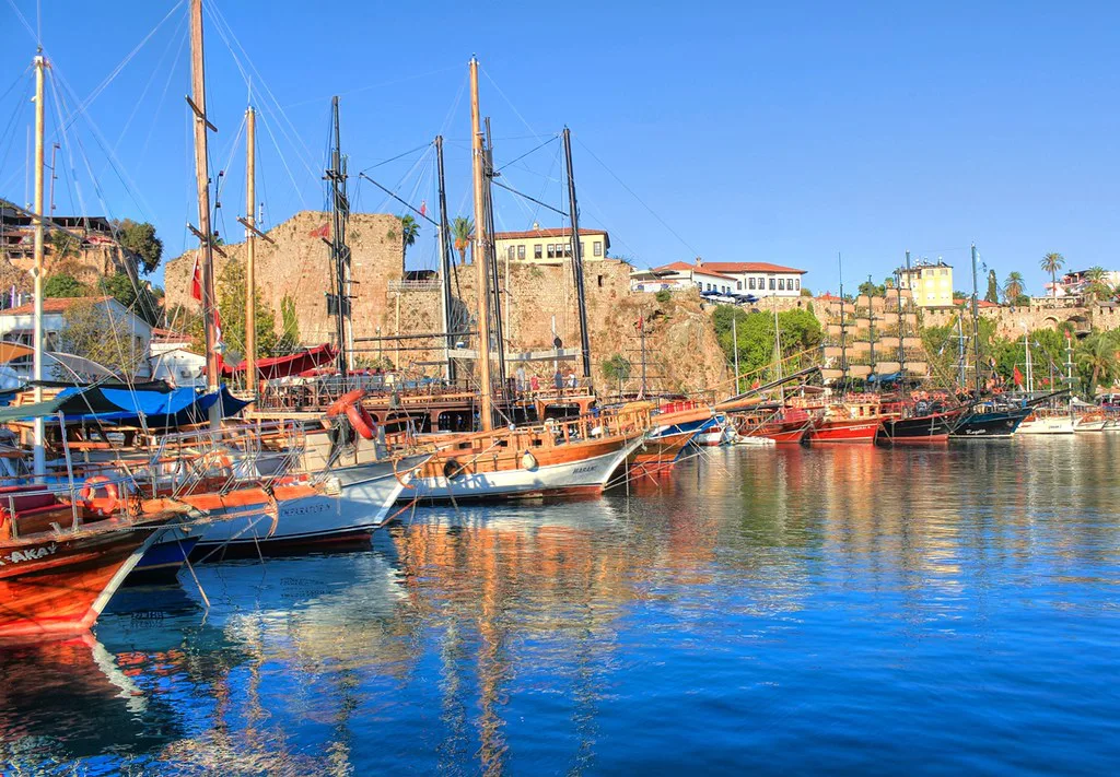Gulets moored in Antalya's old harbour below the walls of Kaleiçi.