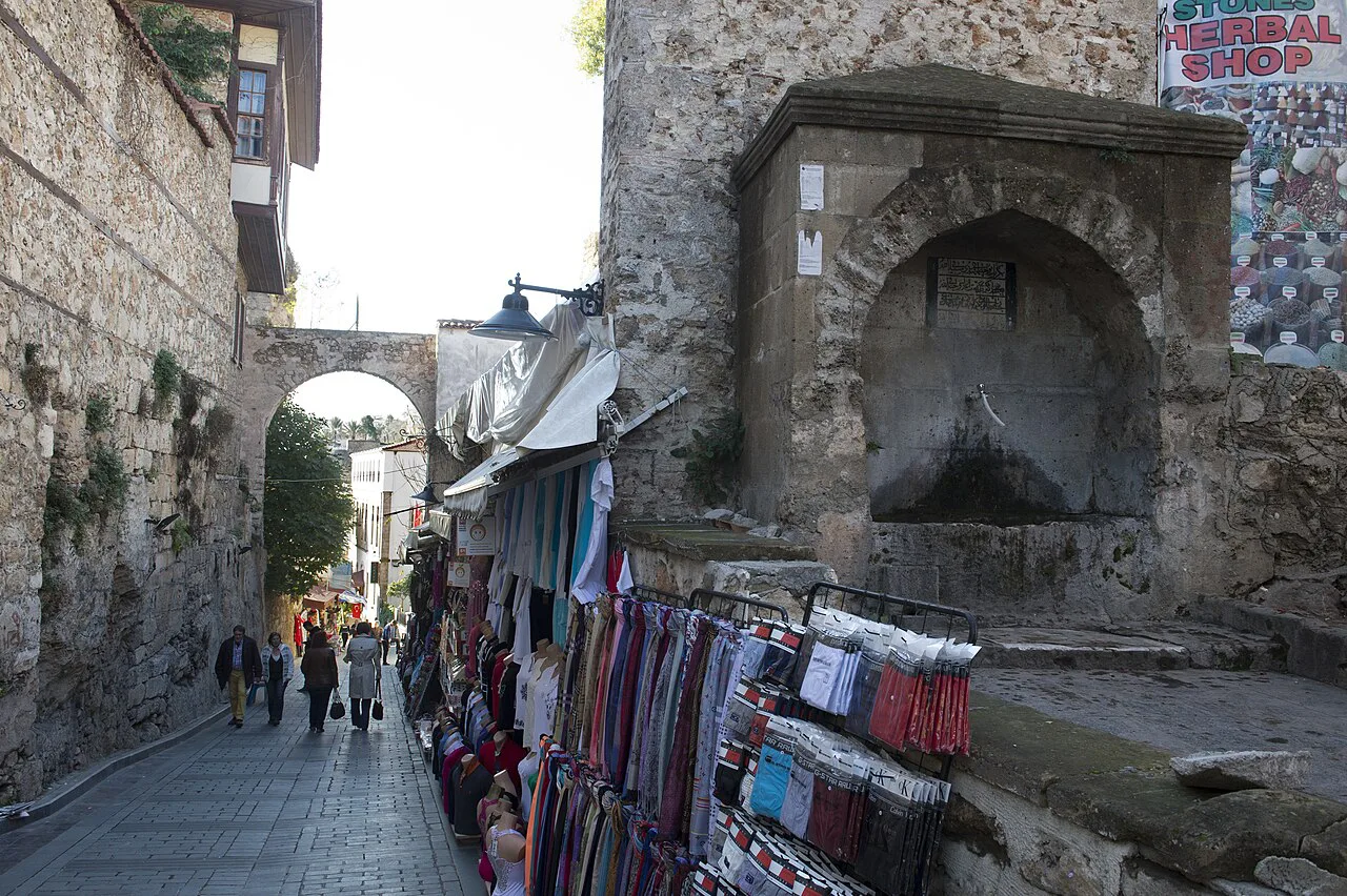 A gate in the old city walls on a shop-lined lane in Kaleiçi, Antalya.