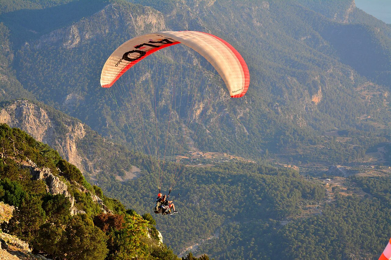 A paraglider over the valley below Babadağ, Fethiye.