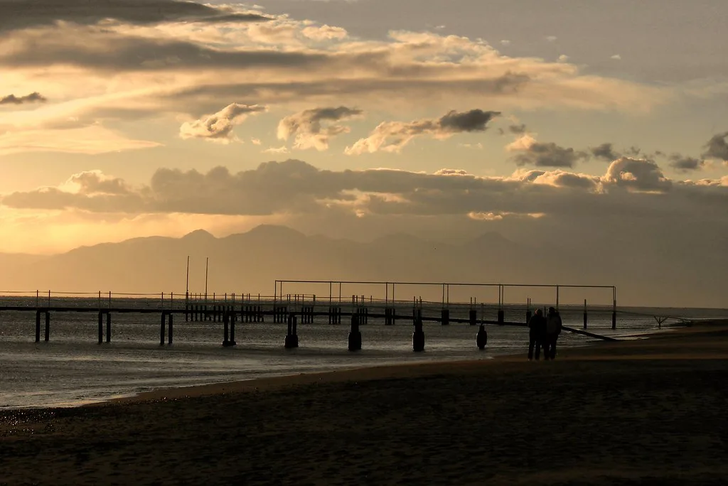 Sunset over a pier on the beach at Belek.