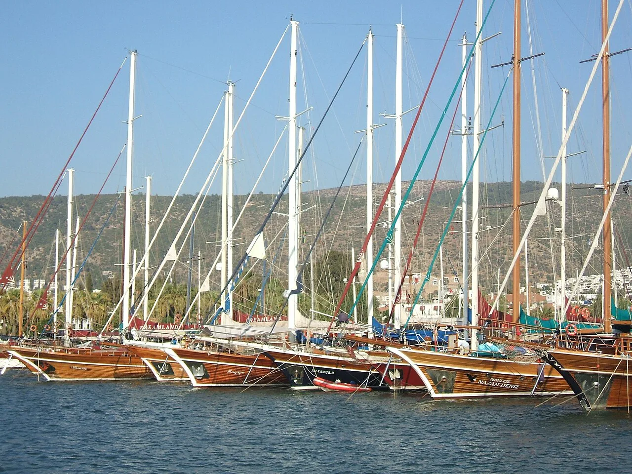 Gulets moored side by side in Bodrum harbour.