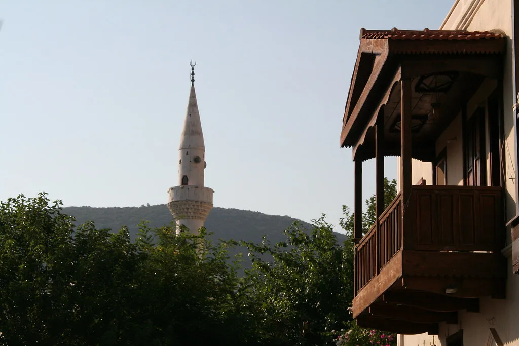 A minaret and an old timber balcony in Kalkan.