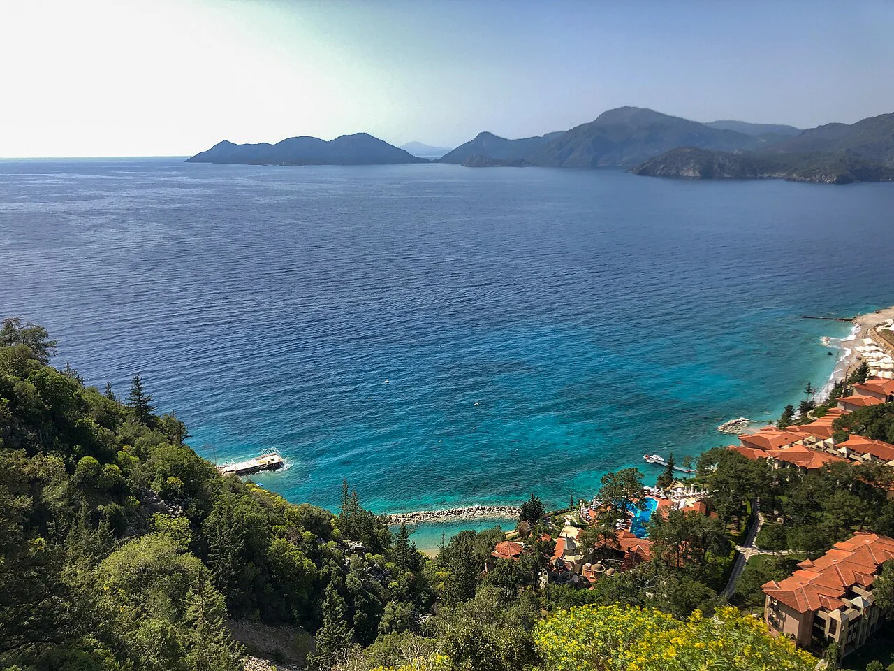 Turquoise water along the wooded coastline at Ölüdeniz.