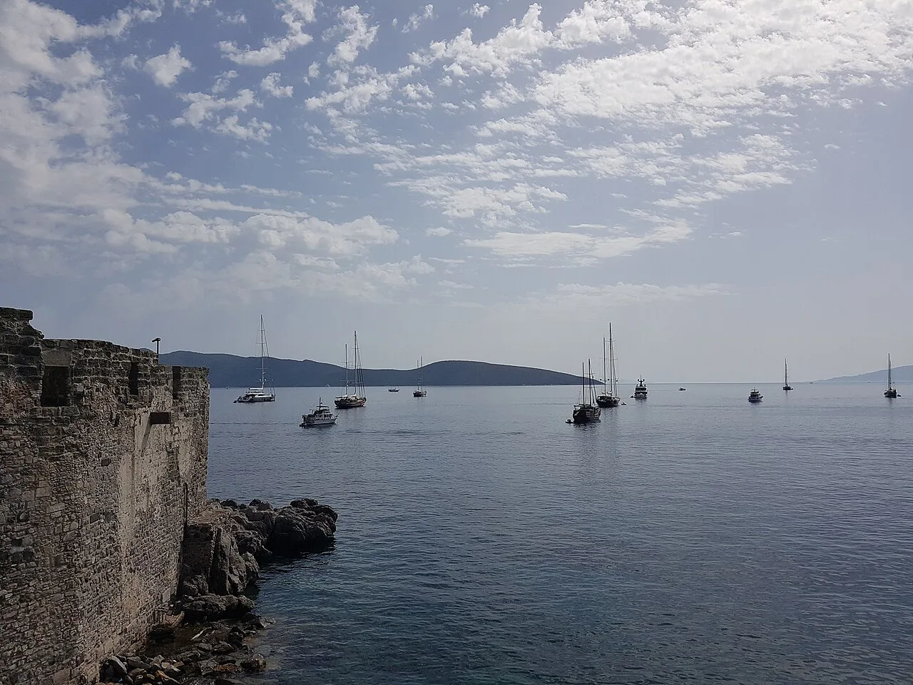 Yachts anchored in the bay below the walls of Bodrum Castle.