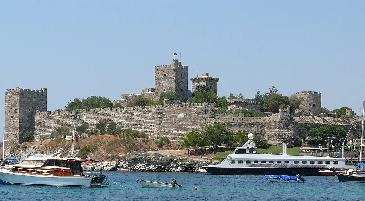 Bodrum Castle seen across the water with excursion boats in front.
