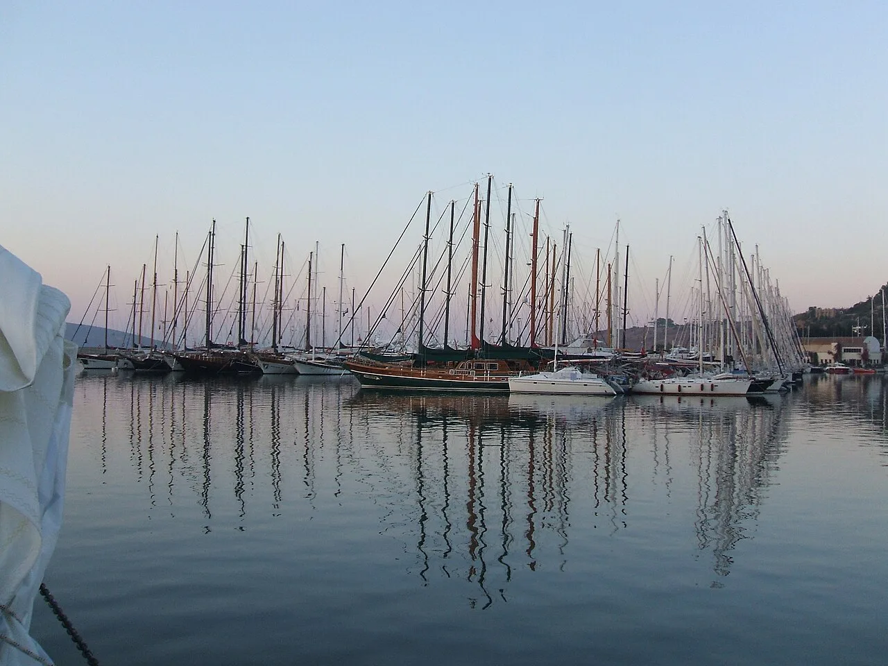 Yachts in Bodrum harbour in calm morning light.