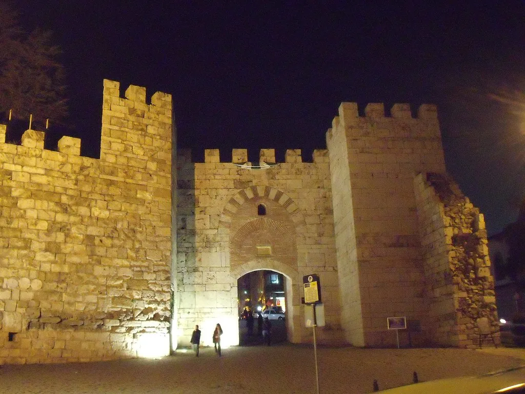 The floodlit gate of Bursa Castle at night.