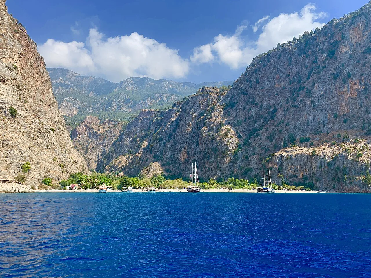 The steep walls of Butterfly Valley rising from the sea near Fethiye.