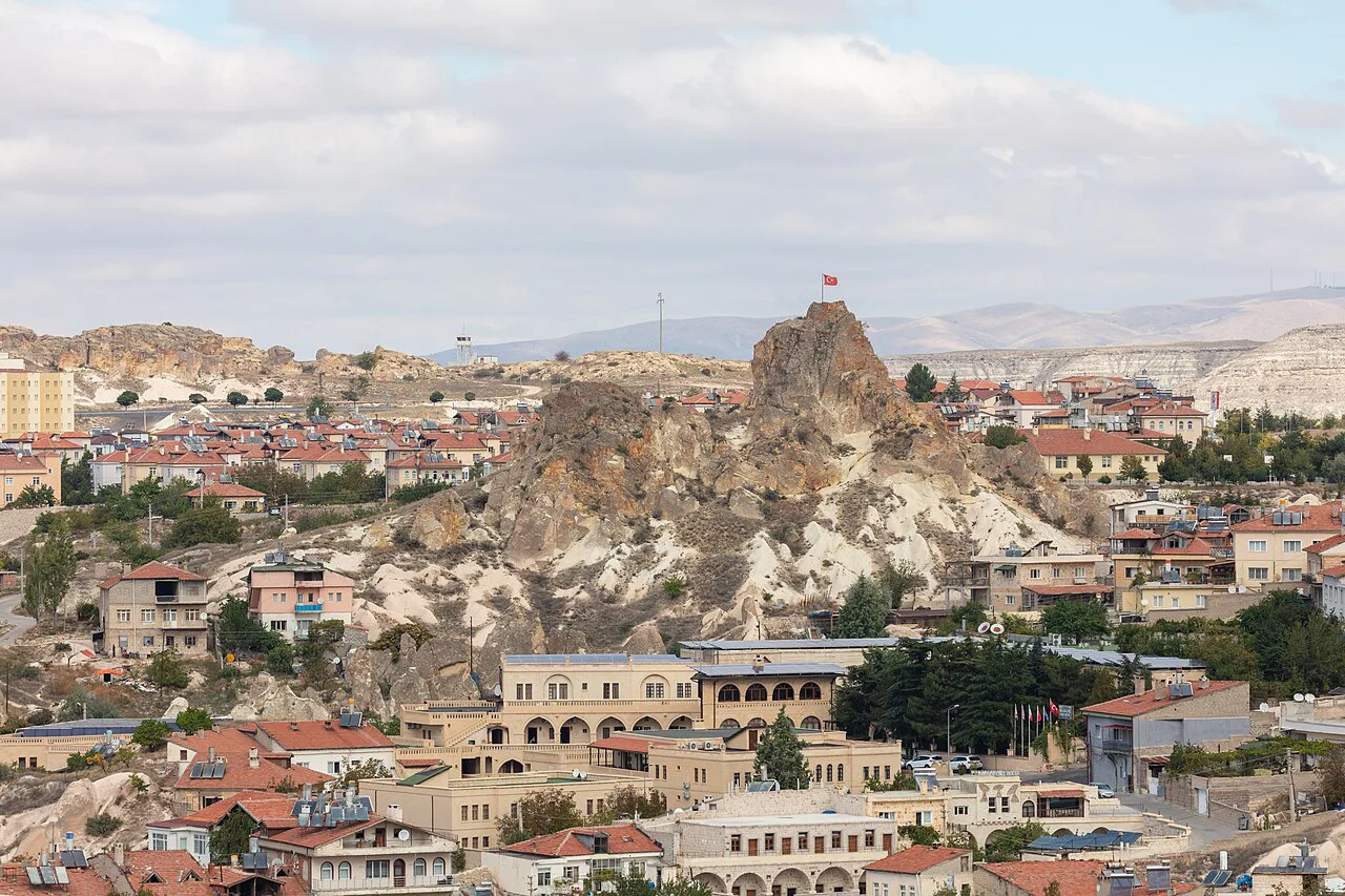 Ortahisar town gathered below its rock castle in Cappadocia.