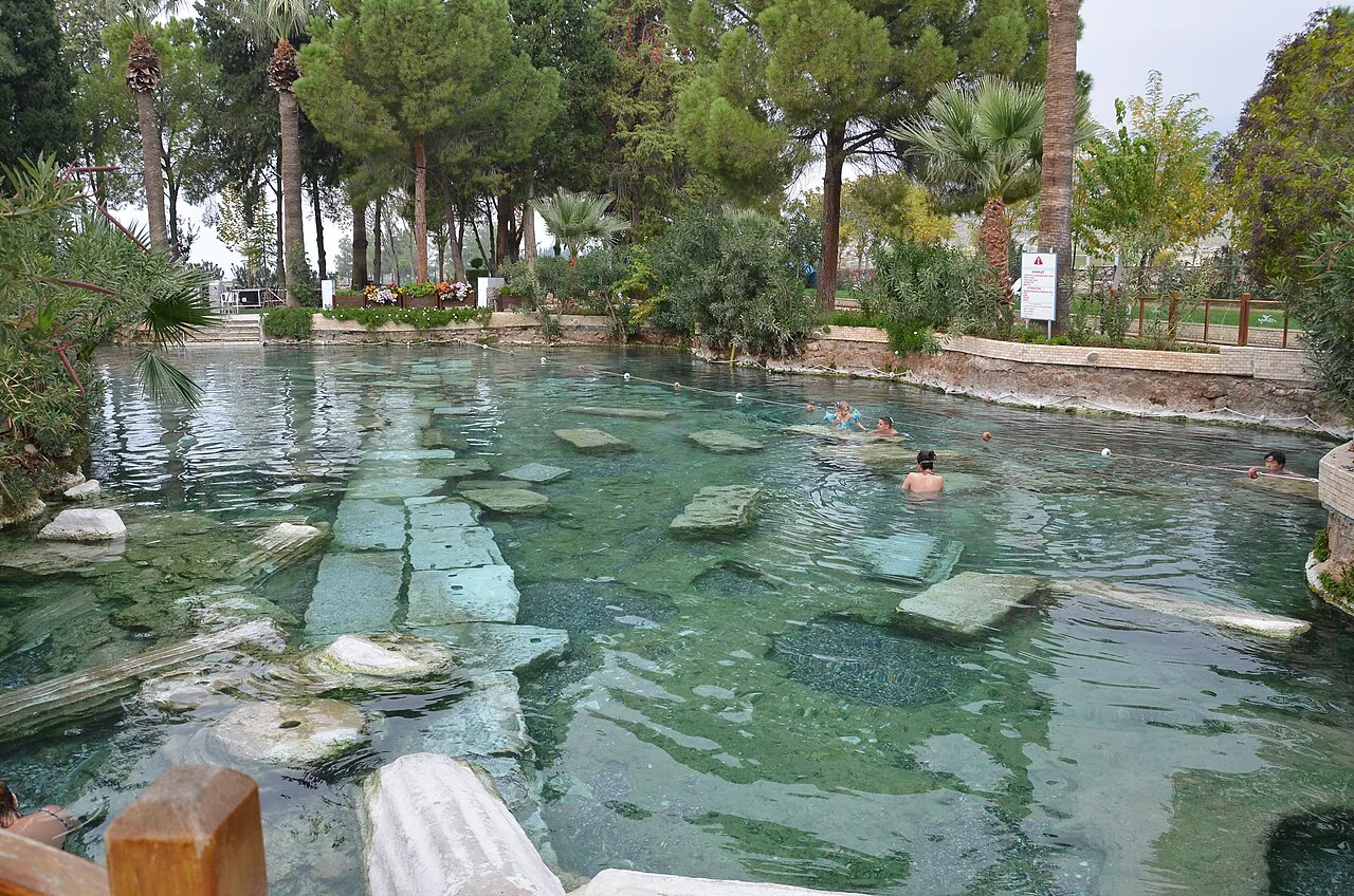 Swimmers among fallen columns in the Antique Pool at Pamukkale.