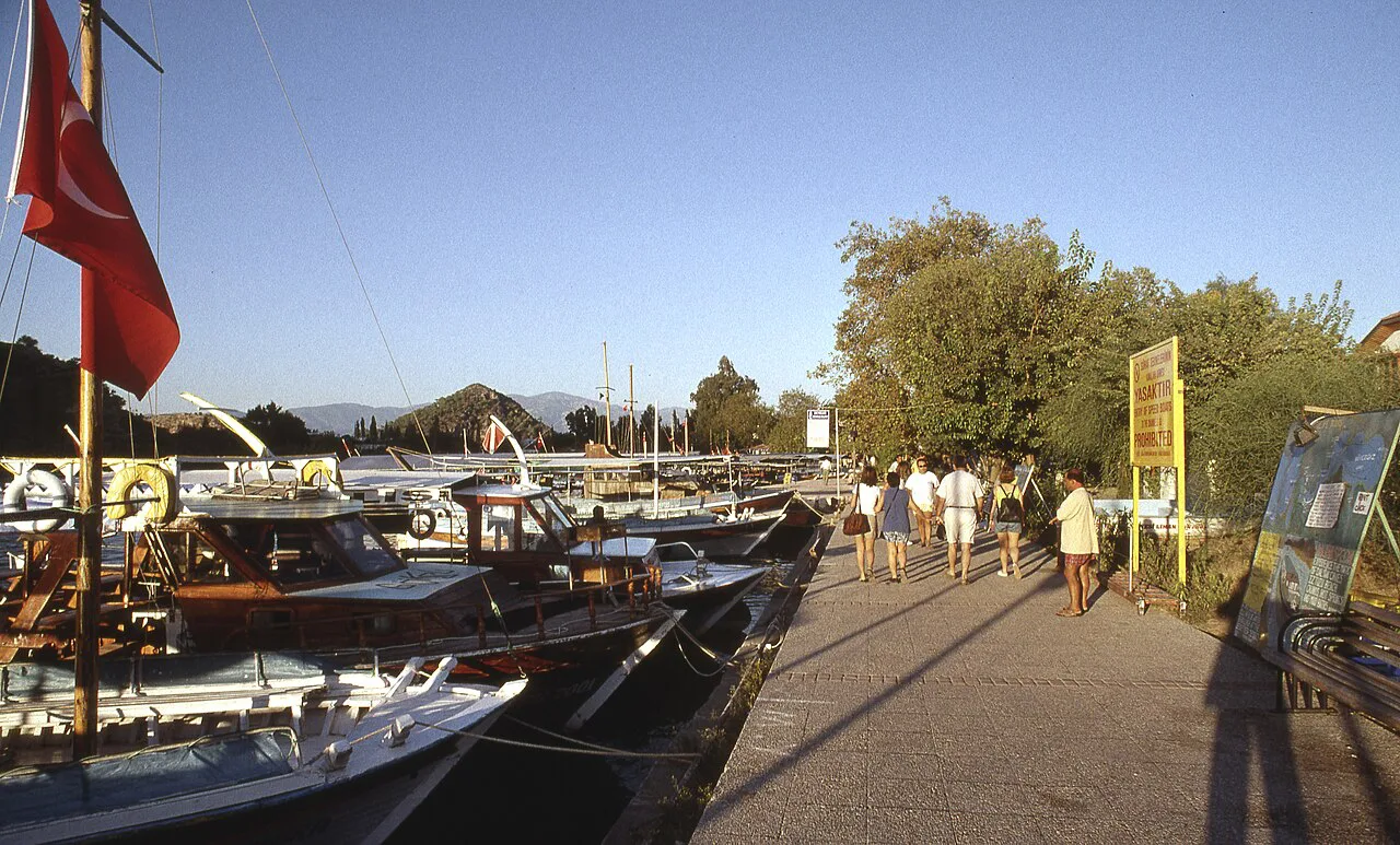 Riverside path and moored boats in Dalyan.