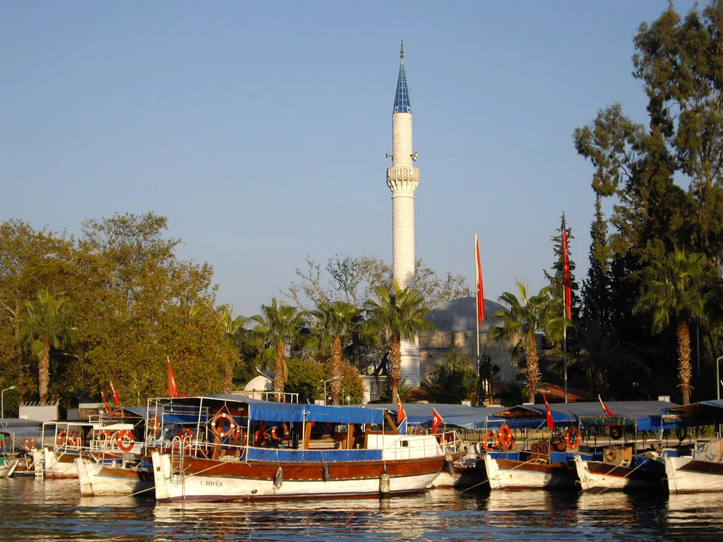 Dalyan's mosque above river boats moored along the waterfront.