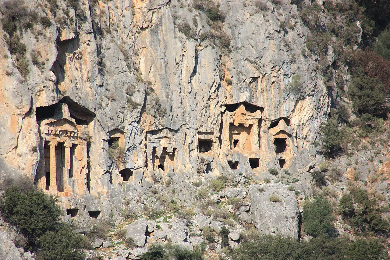 Temple-fronted Lycian tombs carved into the cliff at Dalyan.