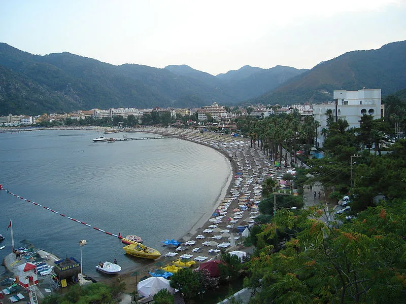 İçmeler beach and seafront seen from above, with mountains behind.