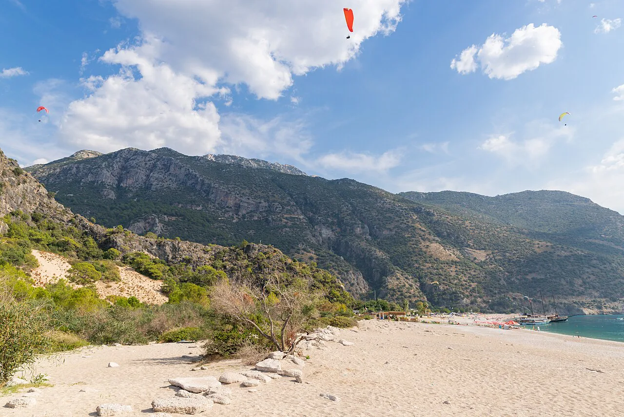Paragliders above the beach at Ölüdeniz's Blue Lagoon.