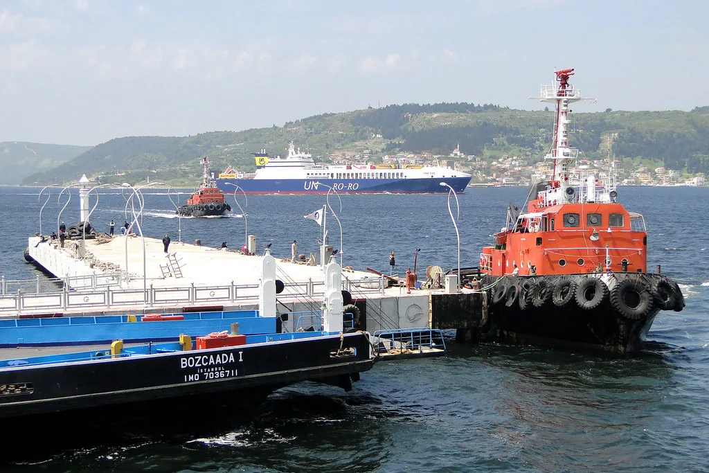 A tug and passing ships in Çanakkale harbour on the Dardanelles.