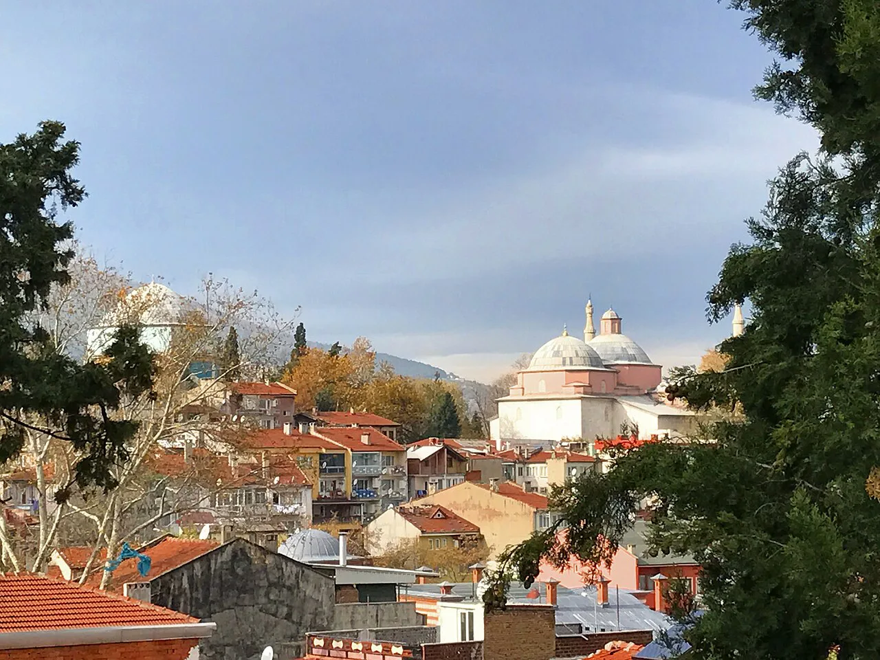The dome of Bursa's Green Mosque seen across the town's red-tiled roofs.