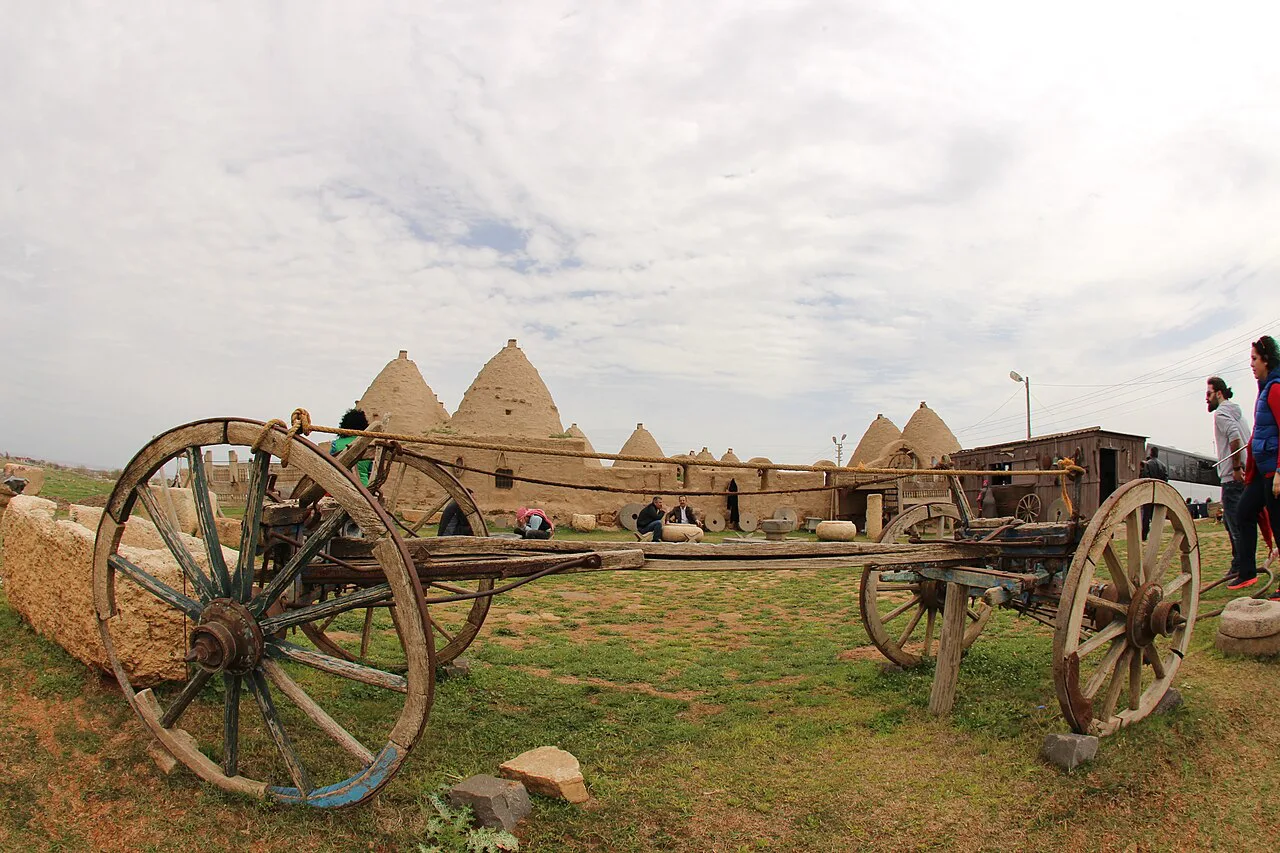 An old cart in front of beehive houses in Harran.