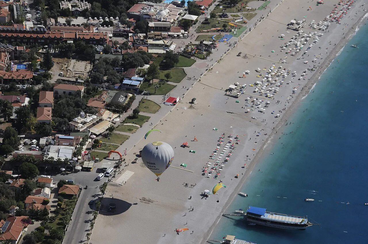 Ölüdeniz beach and seafront seen from above.