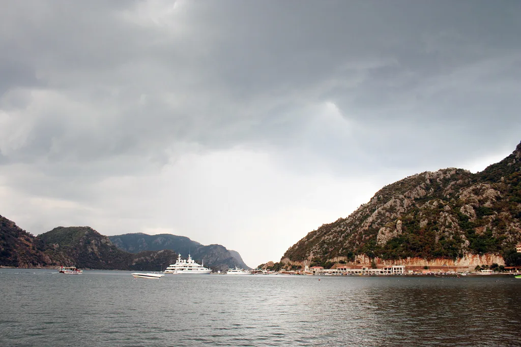 Storm clouds over the rocky headlands of the bay near İçmeler.
