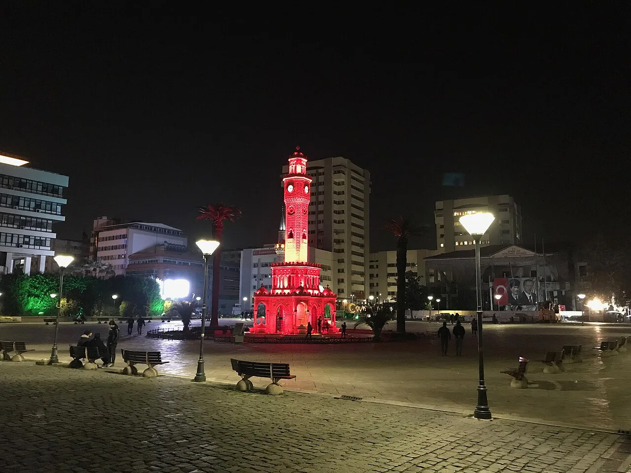 The İzmir Clock Tower lit up at night on Konak Square.