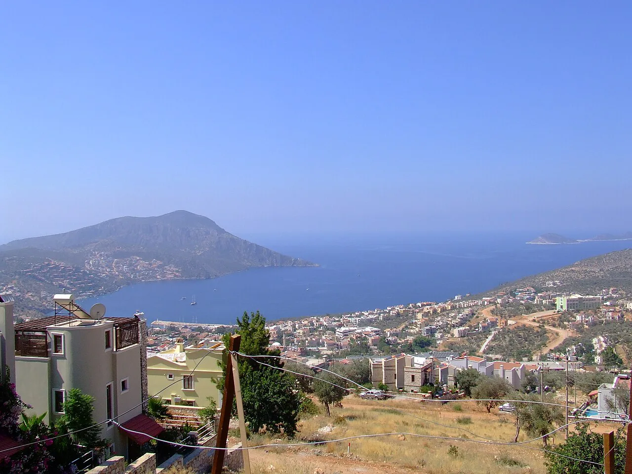 Kalkan's houses spreading down the hillside above the bay.