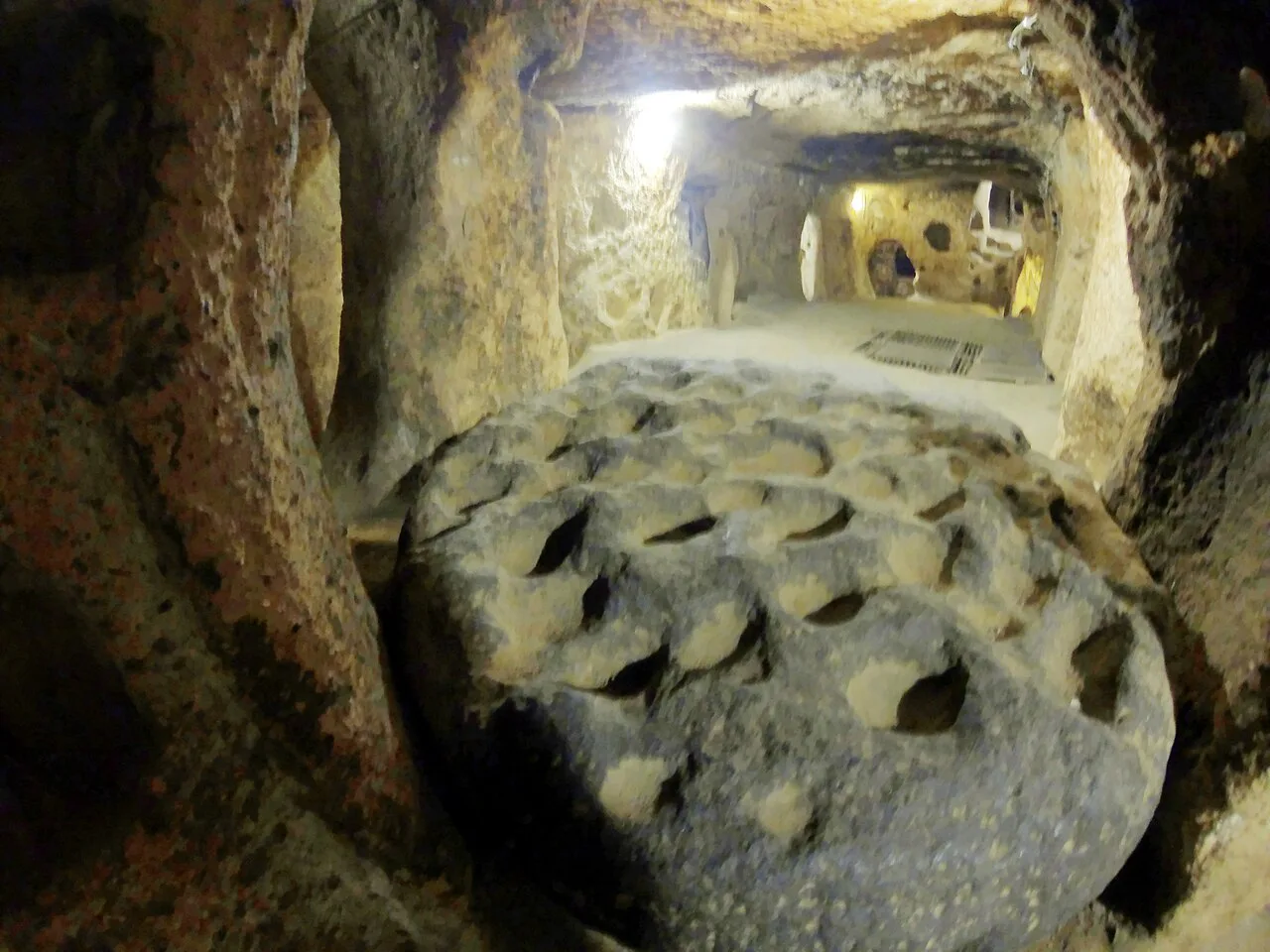 A rolling millstone door in Kaymaklı Underground City.