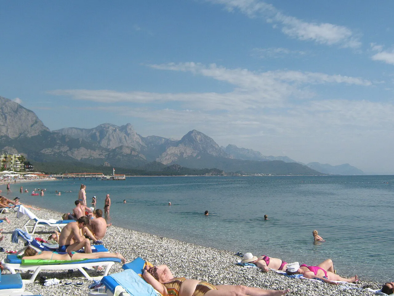 Kemer's pebble beach with the mountains beyond.