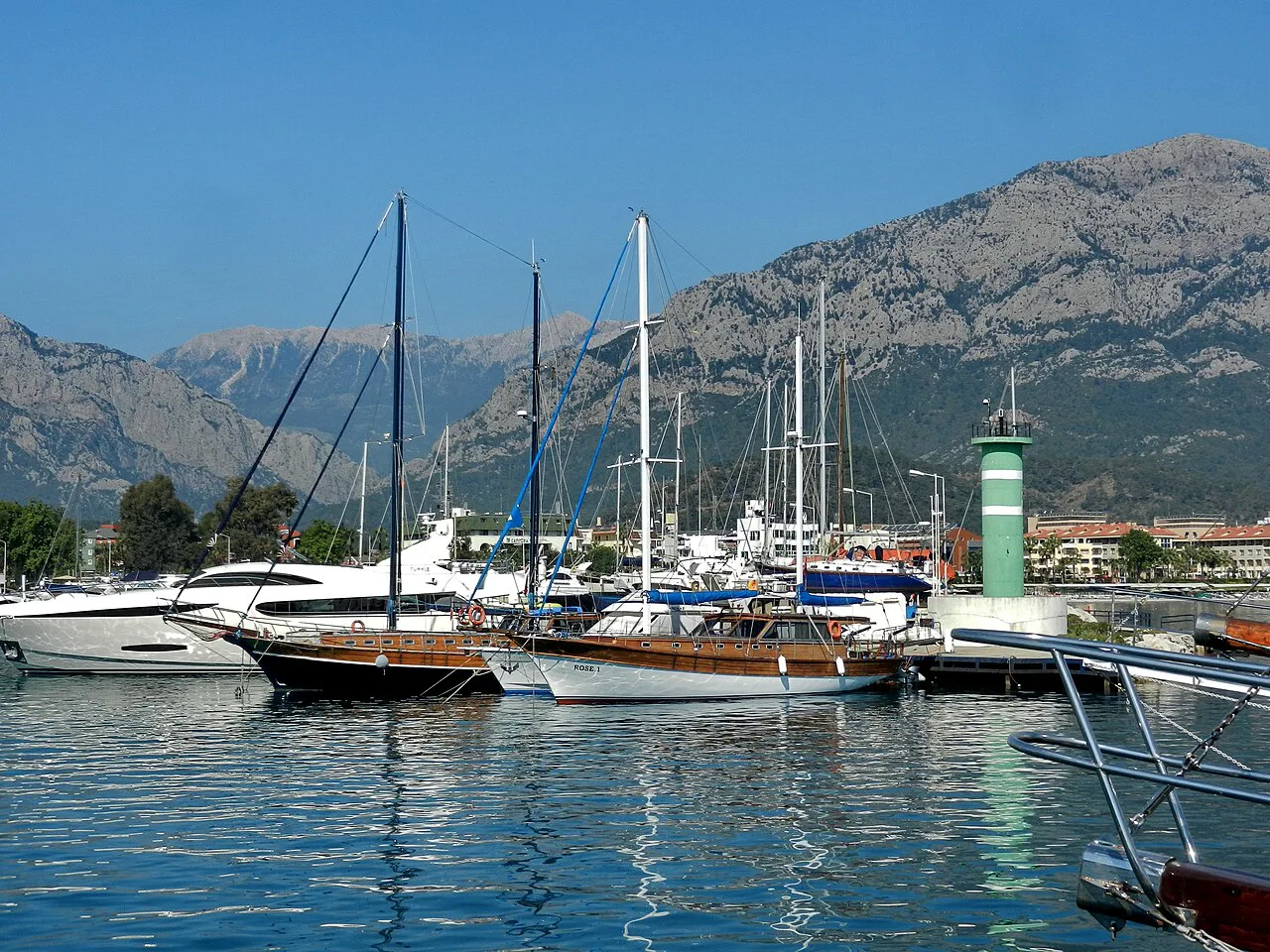 Boats moored by the lighthouse in Kemer Marina.