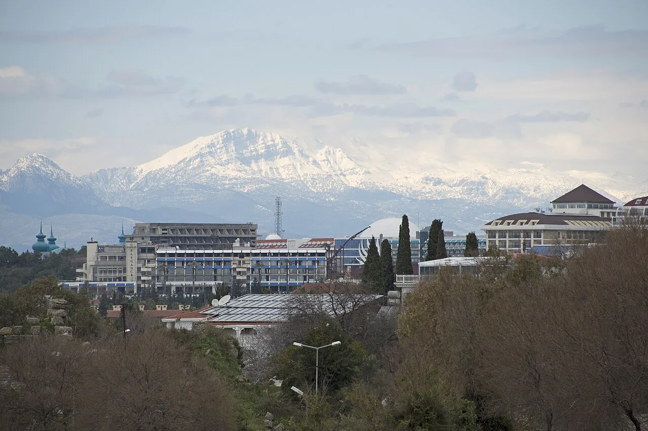 Resort hotels at Kumköy with the snow-capped Taurus Mountains behind.