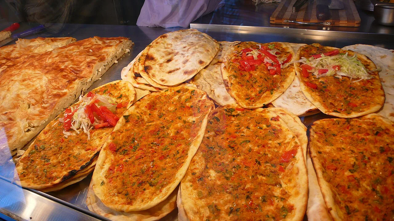Freshly baked lahmacun on a counter in Turkey.