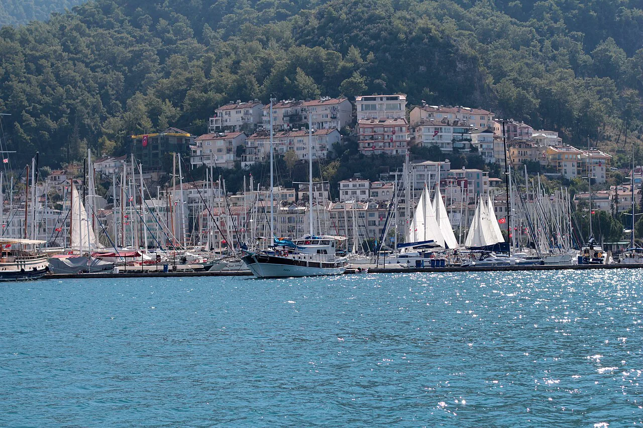 Fethiye bay with yachts moored below the hillside town.