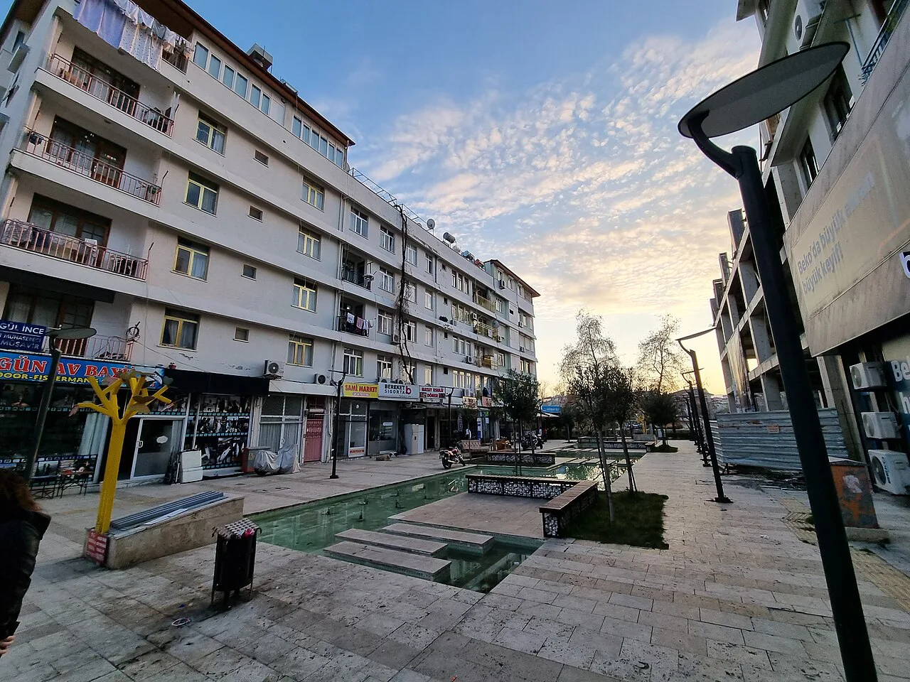 A pedestrian street lined with shops in central Manavgat.
