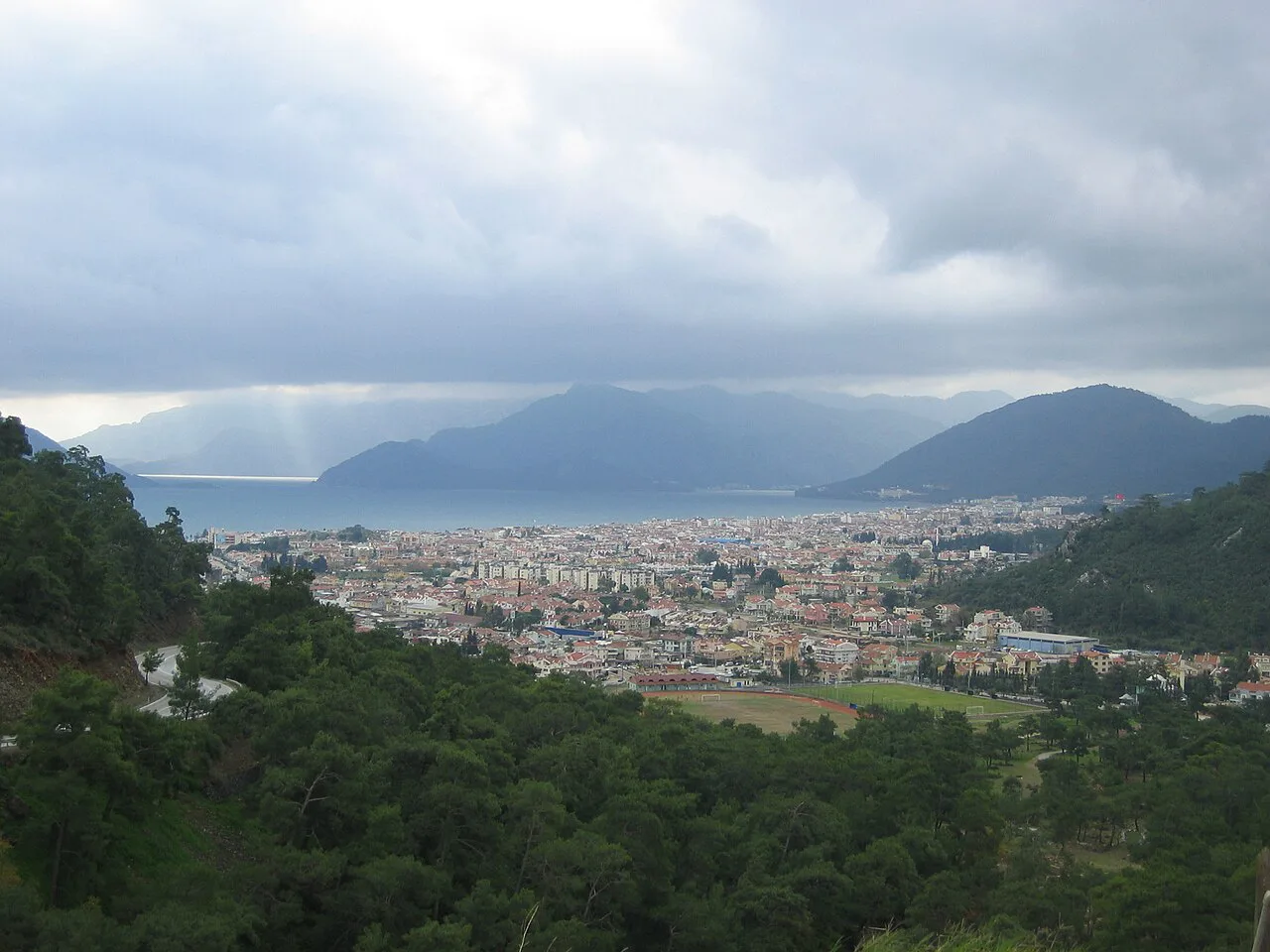 Marmaris and its bay below the surrounding mountains.