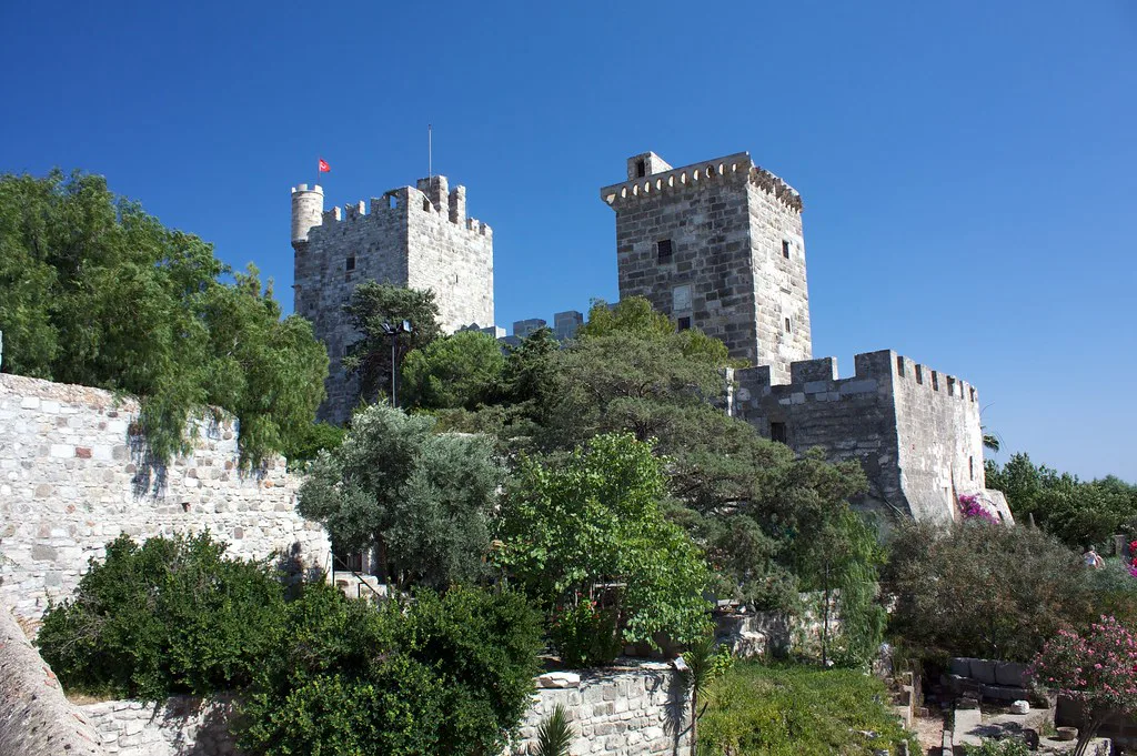 The towers of Bodrum Castle rising above its gardens.