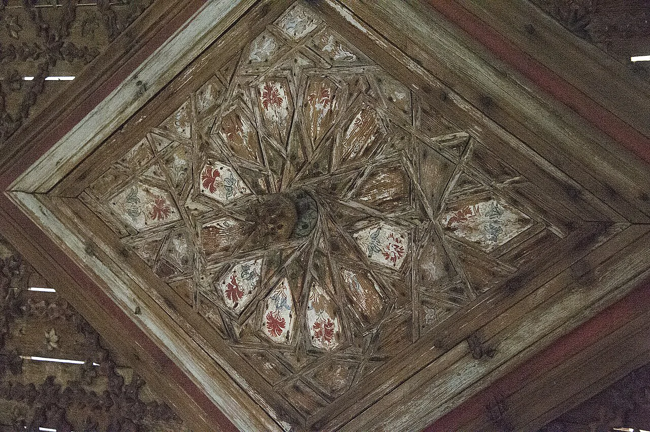A painted wooden ceiling from an old Antalya town house, displayed in a museum.