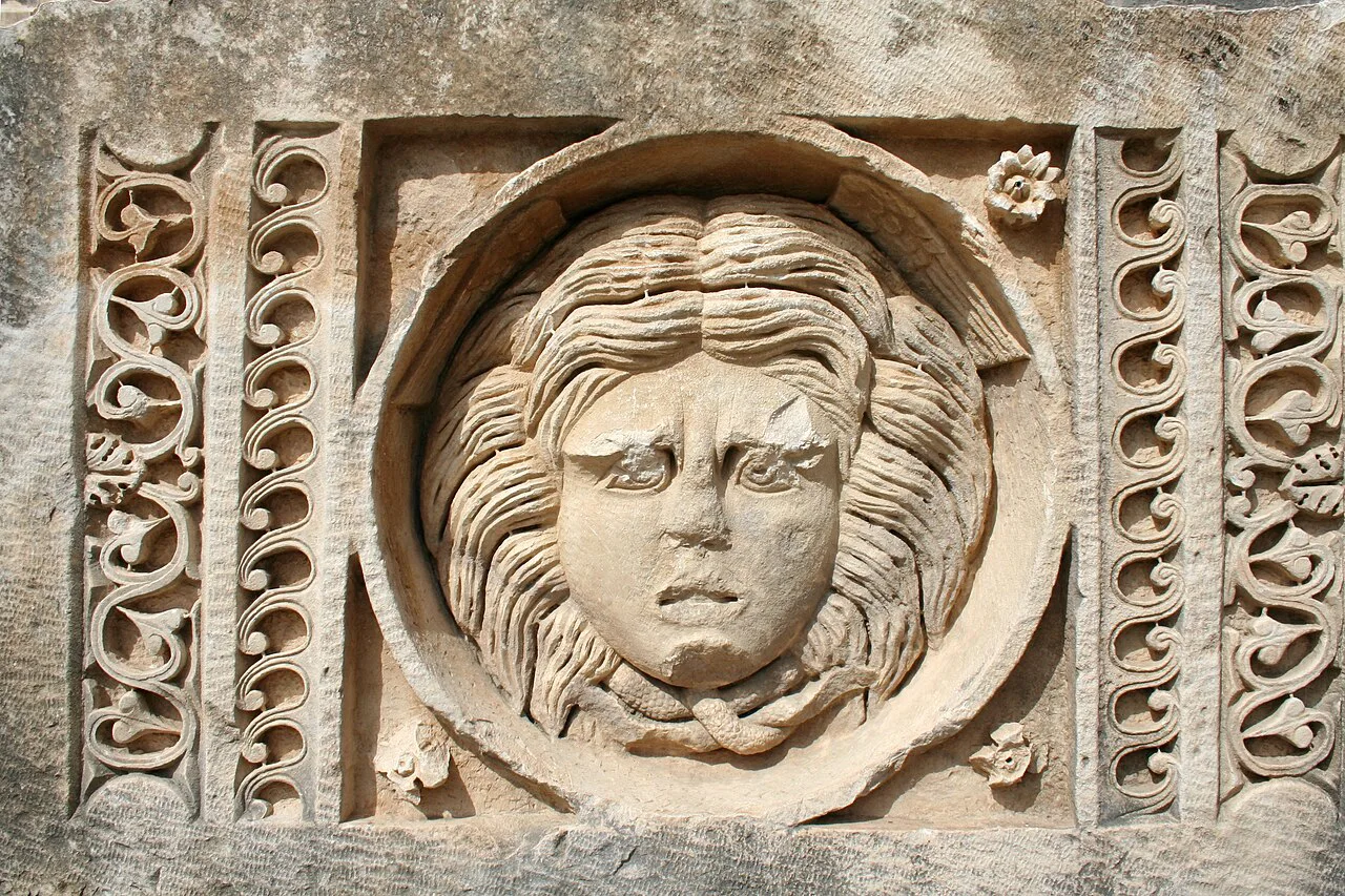 A carved Medusa head among the ruins of Myra.