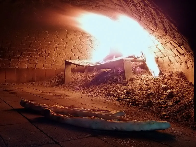 Pide baking in a wood-fired oven.