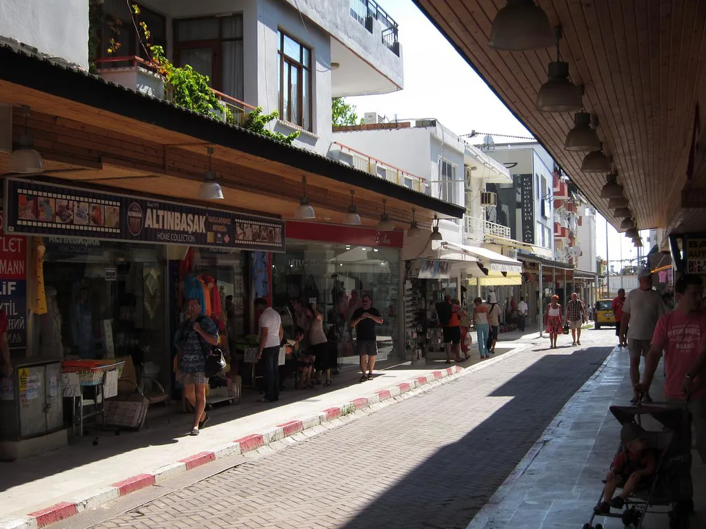 Shops along a shaded shopping street in Belek.