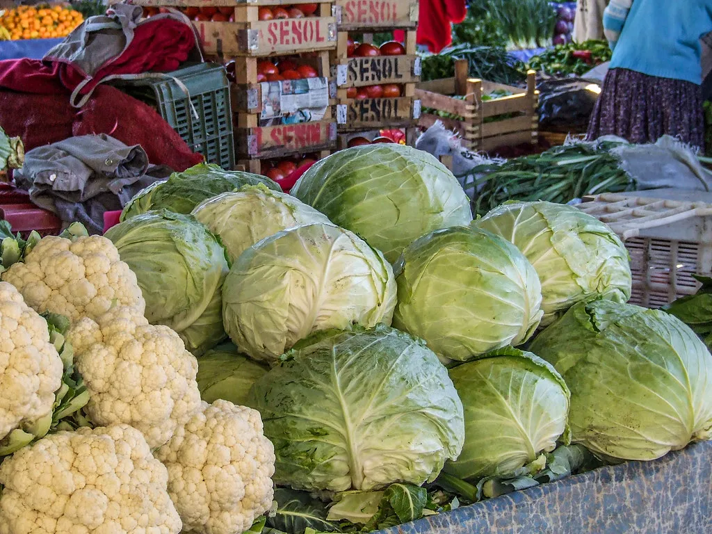 Cabbages and cauliflowers on a stall at Altınkum market in Didim.