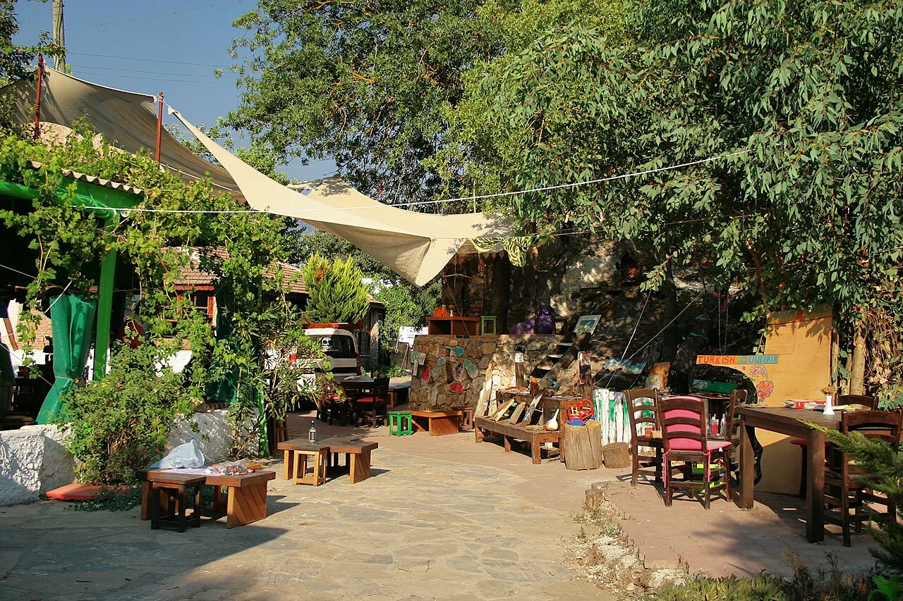 A shaded café terrace with craft displays in Kayaköy, near Hisarönü.