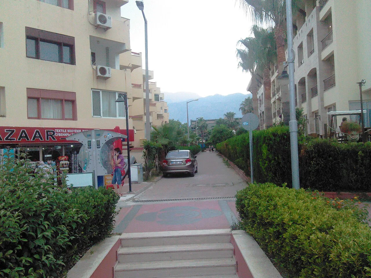 A paved pedestrian street with shops in Kemer.