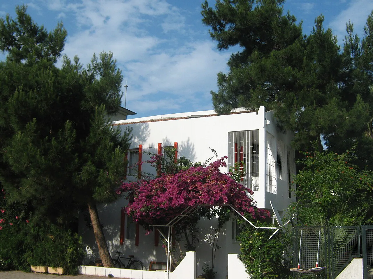 A whitewashed house with bougainvillea in Kemer.