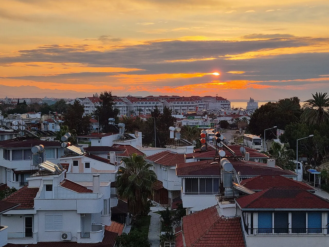 Sunset over the rooftops of Side.